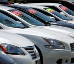 Automobiles are shown for sale at a car dealership in Carlsbad, California