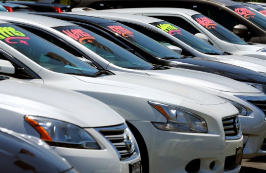 Automobiles are shown for sale at a car dealership in Carlsbad, California