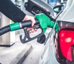 Woman,Pumping,Gasoline,Fuel,In,Car,At,Gas,Station.