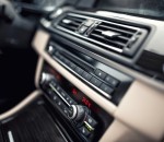 car ventilation system and air conditioning - details and controls of modern car. Concept wallpaper with minimalist industrial design