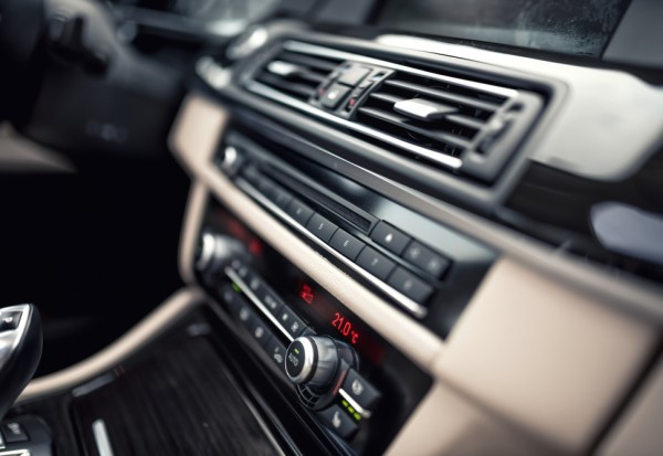 car ventilation system and air conditioning - details and controls of modern car. Concept wallpaper with minimalist industrial design