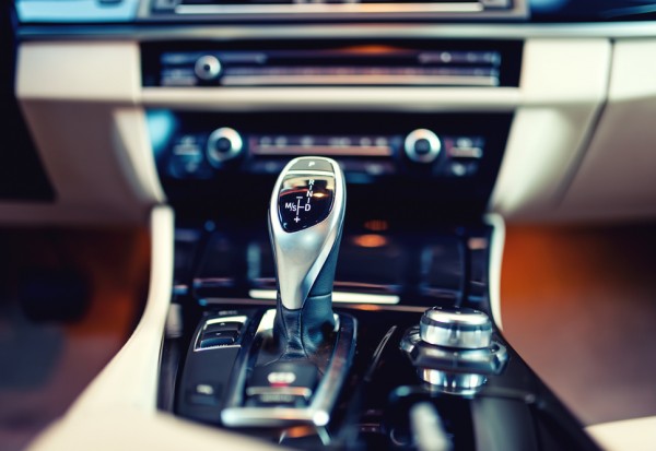 automatic gear shifter in a new, modern car. Car interior with c