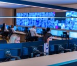 Male computer operator monitoring from a security ( computer, lo