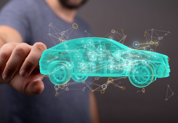 Man's hand pointing at a hologram of an autonomous driving electric car